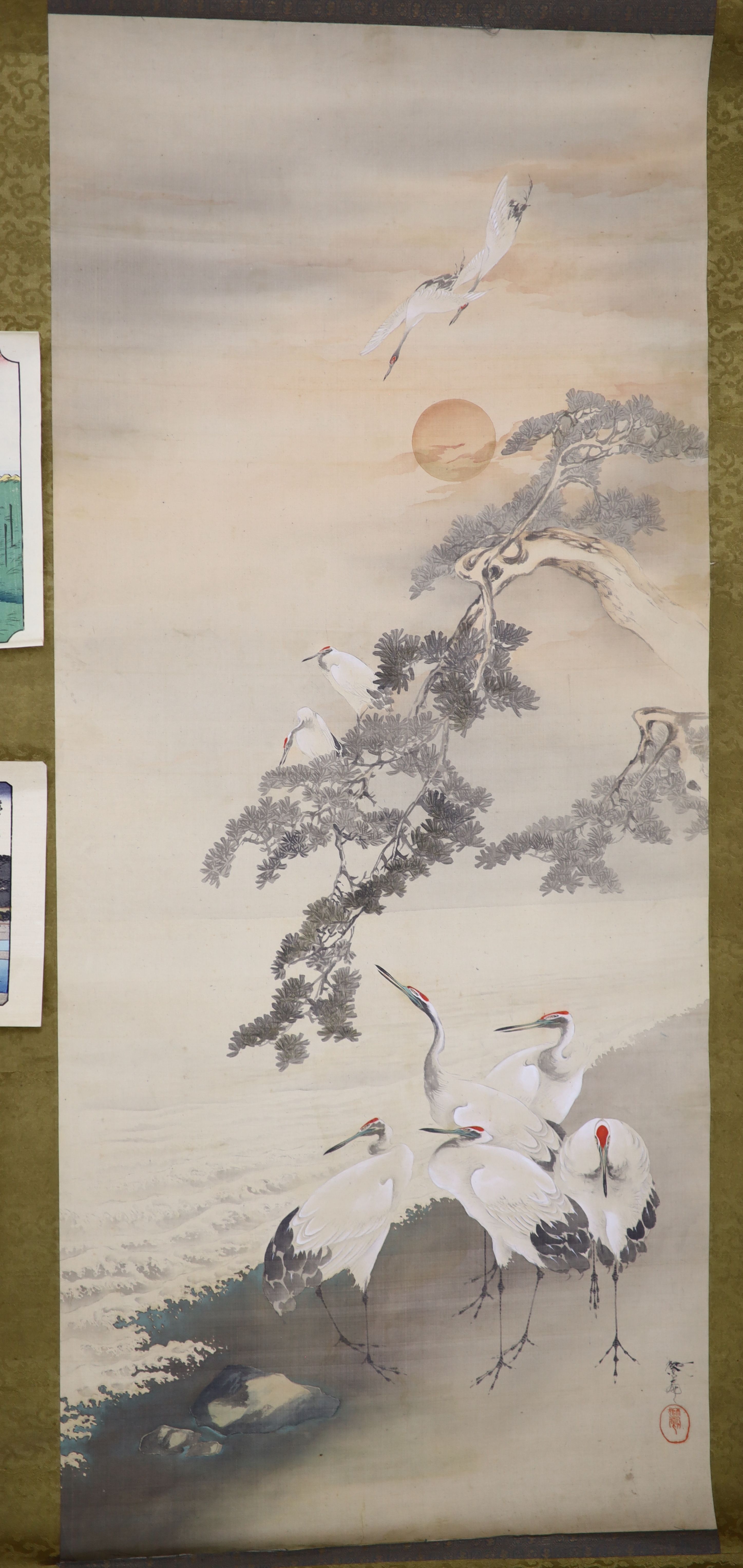 A watercolour on silk scroll painting and three unframed woodblock prints